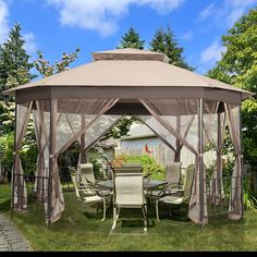 a gazebo sitting on top of a lush green field