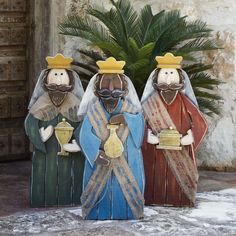 three figurines in the shape of wise men