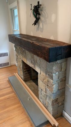 a stone fireplace in the middle of a room