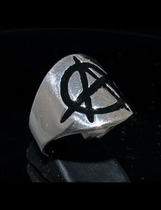 high quality Sterling silver ring high polished marked 925 design: Sterling silver Anarchy ring Circle A Punk symbol UK in Black enamel dimension of the top: 19 mm (along the finger) average weight: 12 grams depending on the size Black Sterling Silver Punk Rings, Silver Punk Rings For Streetwear, Silver Sterling Punk Rings, Silver Sterling Silver Punk Rings, Punk Style Sterling Silver Rings In Silver, Punk Style Sterling Silver Rings, Punk Symbols, A Punk, Average Weight