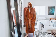 JEDI KNIGHT STYLE COMFORT Whether you're a young Padawan learner or fully realized Master of the Force, this Jedi Master Adult Bathrobe will serve you well. Fashioned after the traditional robes of a Jedi Knight, the highly detailed designs feature an embroidered Jedi Order insignia and a lightsaber hilt at hip. Made of 100% soft-touch polyester fleece material, this Star Wars shower robe is created for pure relaxation after a long day of honing your lightsaber skills. As a guardian of peace and Star Wars Marathon, Lightsaber Hilt, Jedi Order, Jedi Knight, Jedi Master, Star Wars Jedi, Golden Girls, Lightsaber, The Force