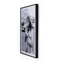 a black and white photo hanging on the wall