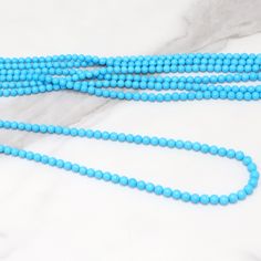 Sleeping Beauty Turquoise 5mm Smooth Rounds Bead Strand Discover the enchanting allure of our 18" Full Bead Strand of Sleeping Beauty Turquoise Smooth Rounds. Each 5mm bead is meticulously crafted from the finest Sleeping Beauty Turquoise, a gemstone renowned for its captivating sky-blue color and minimal veining. Ideal for jewelry designers and stores, these wholesale gemstone beads add a touch of natural elegance to any jewelry piece. Whether you're creating a stunning necklace or a charming b Light Blue Beaded Necklaces With Round Beads, Elegant Turquoise Necklace With Spacer Beads, Turquoise Necklaces With 8mm Round Beads, Turquoise Necklaces With 8mm Beads, Turquoise Necklace With 8mm Round Beads, Turquoise Necklace With Round Beads, Turquoise Beaded Necklaces With 8mm Beads, Turquoise Beaded Necklace With 8mm Beads, Gemstone Beads Wholesale