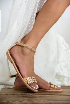 💓 Handmade genuine Greek leather wedding sandals decorated gold or silver. The embellishments are hand sewn onto the leather straps / For brides dreaming of a beach wedding, a Bachelor party or even a city wedding. SIZE CHART EUUSUK 354,52 (21-21,5 cm) 3653 (22-22,5 cm) 3764 (23-23.5 cm) 3875 (24-24.5 cm) 3986 (25-25.5 cm) 4097 (26-26.5 cm) 41108 (27-27.5 cm) 42119 (28 cm) 431210 (29 cm) Full sizes only ** If you have half the size, go UP to the nearest full size ** If you are unsure of your si Gold Round Toe Wedding Shoes For Summer, Gold Closed Toe Sandals With Rhinestones, Gold Embellished Toe Post Sandals, Silver Sandals For Summer Wedding Guest, Silver Sandals For Wedding Guest In Summer, Flat Heel Sandals With Rhinestones For Wedding, Flat Heel Rhinestone Sandals For Weddings, Gold Open Toe Wedding Shoes With Rhinestones, Gold Sandals With Rhinestones And Ankle Strap