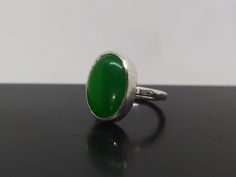 ARTSMYRNA METAL: 925k Silver GEM: Jade ( lab created ) COATING: 24k gold over (We can made a special type of coating for your personal preference ) MATERIEL : 925K Sterling Silver ( Some of my items vermeil gold over silver for looks rich . But i can finish in silver too ) PAYMENT : We accept paypal payment RING SIZE: 6 (your desired size is made) GEM FEATURES AND BENEFITS Benefits of Jade Gem * You can choose this special gem to eliminate emotional and spiritual imbalance and to remain calmer. Green Emerald Cabochon Rings, Handmade Green Jade Rings, Green Oval Cabochon Ring For Gift, Elegant Untreated Green Emerald Ring, Handmade Green Rings For Gifts, Untreated Green Oval Rings, Green Sterling Silver Oval Rings, Handmade Green Emerald Oval Cabochon Ring, Green Oval Sterling Silver Rings