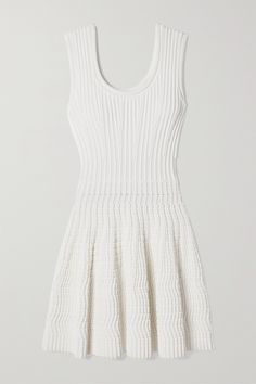 Alaïa's mini dress is made from stretch-knit with ribbed ottoman lines through the bodice and a padded, 3D-style weave at the skirt inspired by car tires. It has an elegant fit-and-flare shape with a scoop neckline that's mirrored at the back. It'll look so chic styled with Mary Jane flats. Knitted Mini Dress, Alaia Dress, White Flares, Model Outfits, Fantasy Gowns, Knit Mini Dress, Dress And Heels, Covet Fashion, White Mini Dress