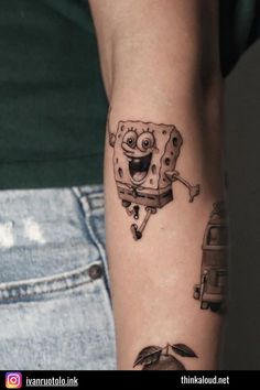 a spongebob tattoo on the left arm