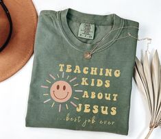 Inspire faith in our "Teaching Kids about Jesus" shirt - a must-have for ministry leaders, ministers, and youth pastors. Elevate your impact in children's ministry with this Christian tee, a blend of comfort and purpose. Make a statement of devotion with our Church Shirt, designed to spark conversations and share the joy of spreading the teachings of Jesus. Embrace the calling with style and comfort - an ideal addition to your ministry wardrobe. Comfort Colors introduces the "Comfort Colors 1717" garment-dyed t-shirt; made 100% with ring-spun cotton. The soft-washed, garment-dyed fabric brings extra coziness to your wardrobe while the relaxed fit makes it an excellent daily choice.  .: The Comfort Colors 1717 tee is made with medium fabric (6.1 oz/yd² (206.8 g/m consisting of high quality, Church Tshirts, Youth Pastor, Church Shirt, About Jesus, Jesus Shirt, Christian Tees, Childrens Church, Christian Shirt, Children's Ministry