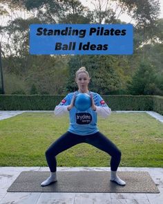 a woman is doing yoga in front of a sign that says standing pilates ball ideas