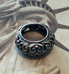 This sale is for a vintage Sterling Silver Ring with a very unique shape. It's a size 6 1/4 and weighs 7.9 grams. The ring pictured is the ring you will receive. It does have some patina on it that I will leave or can clean and shine at the buyers request. Vintage Oxidized Open Ring Jewelry, Vintage Jewelry With Oxidized Finish Open Ring, Vintage Open Ring Jewelry With Oxidized Finish, Antique Silver Engraved Vintage Rings, Handmade Antique Silver Vintage Rings, Vintage Engraved Antique Silver Rings, Vintage Engraved Ring With Antique Finish For Anniversary, Handmade Vintage Antique Silver Rings, Antique Silver Open Ring Vintage Style