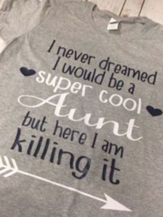 a t - shirt that says i never dreamed i would be a super cool aunt but here i am killing it