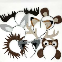 an assortment of animal masks are shown on a white background, including one with antlers and the other with horns