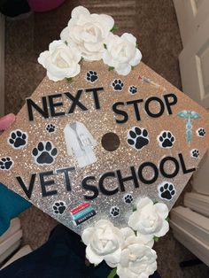 a decorated graduation cap that says next stop vet school with dogs and flowers on it