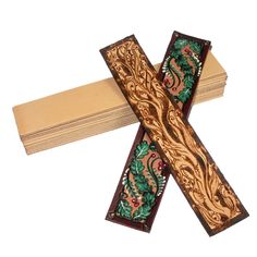 a wooden cross with intricate designs on it