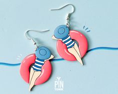 ✨ Pool floatie earrings measuring 4.1 x 3.8 cm (1 5/8" x 1 1/2") - the whole drop length is 6.1 cm (2 3/8") ✨ These colorful earrings are crafted from wood with sterling silver ear wires ✨ Processed within 1-3 business days 🌟 Embrace the fun spirit of summer with our fun pool floatie earrings - a charming blend of quirky and retro elegance! Crafted to capture the essence of a bright summer mood around the pool, these earrings feature adorable ladies in neon pool floaties. The wooden part measur Summer Retro Drop Earrings, Retro Summer Earrings As Gifts, Retro Summer Earrings As A Gift, Disco Pool Party, Neon 80s, Pool Floaties, 80s Earrings, Earrings Summer, Small Jewelry Box