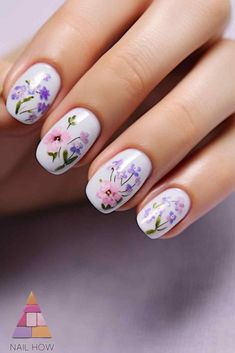 Elevate your nail game with these classy short nail designs! The white base is beautifully adorned with pastel floral patterns, making these nails perfect for a chic and subtle summer look. Discover more short classy nails acrylic ideas at nailhow.com. Short Classy Nails Acrylic, Classy Nails Acrylic, Classy Short Nail Designs, Nails Acrylic Ideas, Short Classy Nails