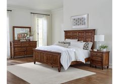 a bedroom scene with focus on the bed and dresser