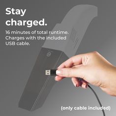 a hand holding an electronic device with the text stay charged 16 minutes of total runtime charges with the included usb cable