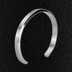 One of our top sellers. It's sleek, simple design makes it a favorite. Whether paired with a business outfit or added to a casual look, its bright shine will make a statement and show that you go the extra mile in how you present yourself. The bangle's polished finish adds a touch of refinement and makes it the perfect finishing touch for any outfit. Material: Stainless steel. Inner diameter: 6cm / 2.4". Width: 6mm / 0.2". Minimalist Stainless Steel Bangle For Formal Occasions, Solid Color Adjustable Minimalist Jewelry, Elegant Everyday Solid Color Jewelry, Classic Bangle Bracelet With Simple Design, Adjustable Minimalist Cuff Bracelet, Adjustable Minimalist Round Cuff Bracelet, Adjustable Sleek Cuff Bracelet Bangle, Modern Formal Bracelets With Simple Design, Minimalist Formal Bracelet With Simple Design