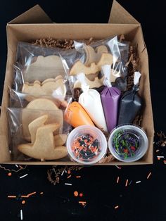 an open box filled with cookies and other treats