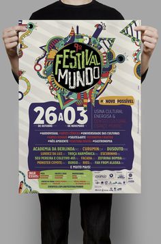 a man holding up a poster for festival mundo