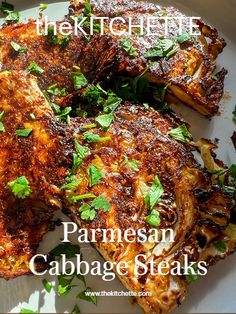 the kitchen life parmesan cabbage steaks on a white plate with garnishes