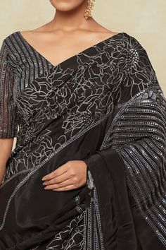 Black saree with sequin embroidered floral and linear pattern. Comes with matching embroidered blouse and a petticoat. - Aza Fashions Embroidered Georgette Pre-draped Saree For Formal Occasions, Formal Festive Pre-draped Saree With Intricate Embroidery, Evening Traditional Wear With Intricate Embroidery On Georgette, Evening Traditional Wear With Intricate Embroidery, Evening Blouse With Intricate Embroidery In Georgette, Evening Georgette Blouse With Intricate Embroidery, Formal Georgette Saree With Intricate Embroidery, Elegant Embroidered Unstitched Blouse For Navratri, Elegant Sequined Embroidered Fabric For Navratri