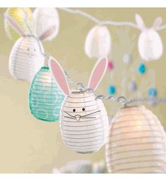 some paper lanterns with bunny ears on them