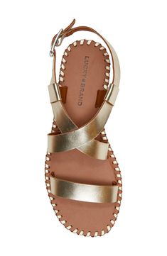 Decorative whipstitching and crisscrossing straps lend visual intrigue to a leather sandal secured with an adjustable strap at the ankle. Adjustable ankle strap with buckle closure Leather upper/synthetic lining/rubber sole Imported Strap Sandals Women, Sandal Women, Ankle Strap Sandals, Leather Sandals, Lucky Brand, Ankle Strap, Rubber Sole, Adjustable Straps, Leather Upper