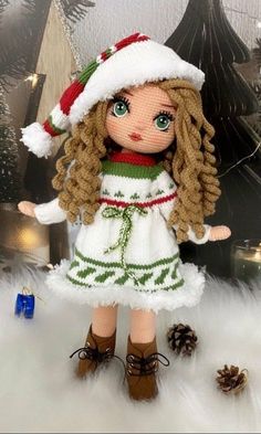 the doll is wearing a santa hat and dress with boots on it's feet