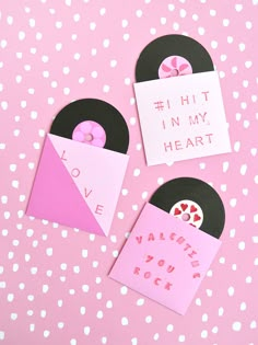 two valentine's day crafts made out of record records and paper with words written on them