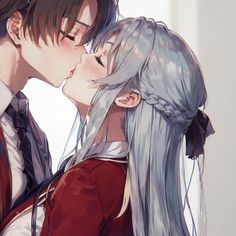 two people kissing each other with long hair