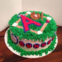 a cake with green frosting and letters on it