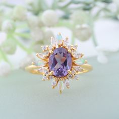 Color Changing Alexandrite Engagement Ring,14K Yellow Gold Ring, Opal Cluster Promise Ring Bridal Jewelry, June Birthstone Anniversary Gift  Brand - LATELIERDBIJOUX Type Of Stone - Alexandrite Stone created - Lab-created. Cut of Stones - Oval- Cut Stone size - 8x6mm Stone Color - Purple second stone - CZ diamond second stone shape - Round/Marquise second stone color - Colorless Third stone - Opal (Lab Created) second stone shape - Marquise second stone color - Fire Opal Check out my other items! Wedding Cluster Gemstones With Accent Stones, Cluster Gemstone Accents Jewelry For Wedding, Gold Cluster Rings With Gemstone Accents, Gold Cluster Jewelry With Gemstone Accents, Gold Cluster Birthstone Ring With Gemstone, Gold Amethyst Wedding Ring With Gemstone Accents, Gold Amethyst Ring With Gemstone Accents For Wedding, Gold Gemstones With Halo Setting For Wedding, Gold Cluster Ring With Birthstone