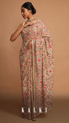 Beautified in the traditional art of Kashida embroidery and paisley & floral motifs, this beige hued georgette saree oozes charm and regality. This beauty is perfect to complement and enhance the poise and uniqueness of the wearer.
. Kashida Embroidery Motifs, Trousseau Outfits, Kashmiri Embroidery Saree, Western Saree, Kashida Embroidery, Official Dresses