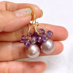 "Petite pearl hoops with amethyst gemstones cluster. Genuine Edison pearls are 10-11 mm. Faceted amethyst rondelles meassured 4-5 mm in size. Hand shaped 14k gold filled French ear wires Earrings total length is approximately 1.5\" including ear wires. As you can see in the photos there are naturally occurring blemishes that give these pearls characters. These are stock photos so please note pearls shapes and colors are vary due to availability." Purple Amethyst Jewelry With Pearl Drop, Purple Dangle Pearl Drop Earrings, Purple Pearl Drop Dangle Earrings, Purple Pearl Drop Round Bead Jewelry, Edison Pearls, Pearls Earrings, Open Cuff Bracelet, Pearl Bangle, Easy Diy Jewelry