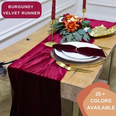 the table is set with red napkins and place settings for two people to sit at