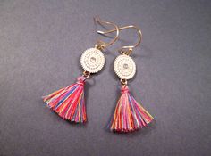 Rainbow cotton tassels (1 inch) are a mix of yellow, green, blue, pink, red, and purple, on whitewashed oval pendants with tiny rhinestone centers, and gold french hook ear wires. These earrings measure just under two and 1/2 inches in length See more of my designs here; justEARRINGS.etsy.com And please visit my sister~shops; justCHARMING.etsy.com & BohoDreamJewelry.etsy.com All of my jewelry shops offer FREE SHIPPING! Highlights: handmade jewelry, tassel earrings, rainbow cotton, gold ear w Colorful Bohemian Dangle Tassel Earrings, Rainbow Dangle Tassel Earrings, Multicolor Tassel Drop Earrings, Bohemian Yellow Adjustable Tassel Earrings, Yellow Bohemian Tassel Earrings, Red And Purple, Gold Dangle Earrings, Oval Pendant, Gold Earrings Dangle