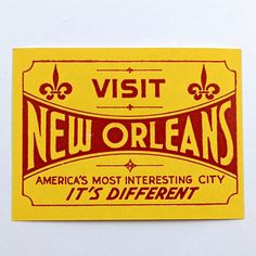 a yellow and red new orleans sticker on a white surface