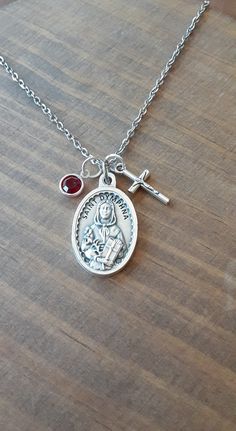 "Anxiety Relief Necklace features a beautifully detailed Saint Dymphna Medal, a dainty silver crucifix and a genuine Swarovski crystal birthstone charm. Oval St. Dymphna medal was made in Italy of oxidized silver and is 1 1/8 inches tall. Let lovely Saint Dymphna help you handle challenges both big and small, and restore your peace of mind. Stainless steel chain (non-tarnish and hypoallergenic) in your favorite length. Gift box included with your purchase. KIND REVIEWS: \"Absolutely beautiful!! Saint Dymphna, St Dymphna, Saint Necklace, Gothic Design, Healing Necklace, Jewelry Care Instructions, Birthstone Charms, Oxidized Silver, Birthstone Necklace