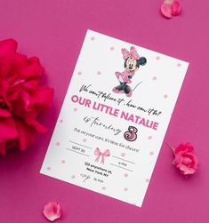 a minnie mouse birthday party with pink flowers