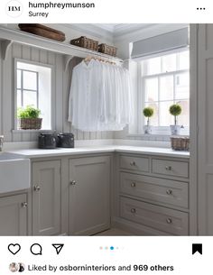 an image of a kitchen setting with white cupboards and drawers on the left side