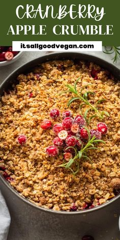 cranberry apple crumble in a skillet with fresh cranberries on top