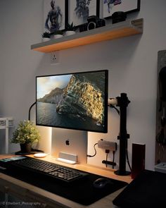 a desktop computer sitting on top of a wooden desk