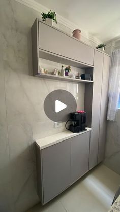 a kitchen area with a counter, cupboards and window