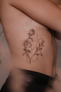 a woman's stomach with flowers on it