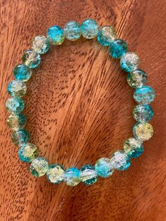 Super cute teal, aqua & clear stackable crackle glass bead bracelets. Would make great bridesmaids gifts or friendship bracelets. Beads are 8 mm in size with stretchy elastic fit. I also have 11 other colors to choose from or you can mix and match colors. Just specify in the personalization area or message me directly. This can also come as a wristlet keychain, hardware available in 5 different colors, for $3.00 extra. Customizable & personalizable. Free Shipping. Message me with any questions. Turquoise Czech Glass Jewelry For Party, Party Jewelry In Turquoise Czech Glass, Turquoise Czech Glass Party Jewelry, Adjustable Turquoise Crystal Bracelet For Parties, Adjustable Turquoise Glass Bracelets, Party Bracelets With Turquoise Faceted Beads, Party Bracelet With Turquoise Faceted Beads, Party Turquoise Bracelets With Faceted Beads, Turquoise Bracelets With Faceted Beads For Party