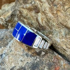 This beautiful Sterling Silver Ring, as part of the Blue Water collection, features Royal Lapis & Denim Lapis. Ring Width: 3/8"; Ring Shank: 1/4" The ring is designed by David Rosales, one of the finest contemporary Southwest Artists in the world. He is the founder and co-owner of Supersmiths, Inc. of Gallup, NM. Each ring is custom made and carries a lifetime guarantee.