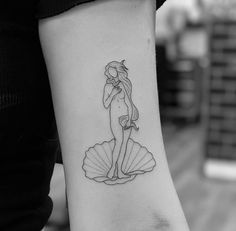 a woman with a tattoo on her arm