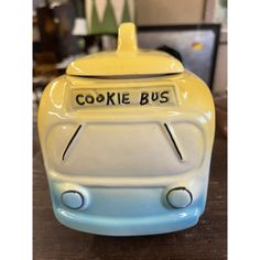 a ceramic cookie bus is sitting on a table